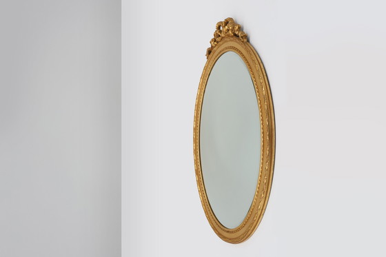 Image 1 of Oval shaped carved gilded Baroque mirror with beveled glass, Belgium  