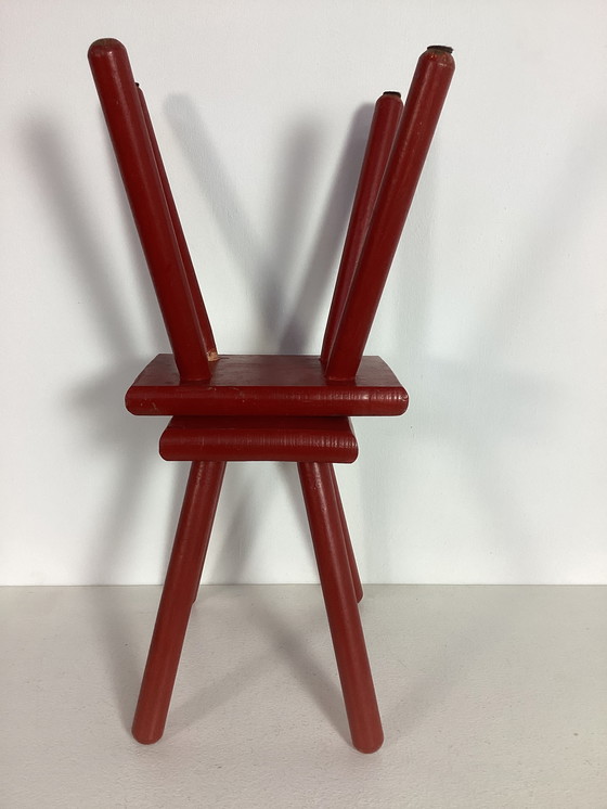 Image 1 of Two red vintage wooden stools side tables