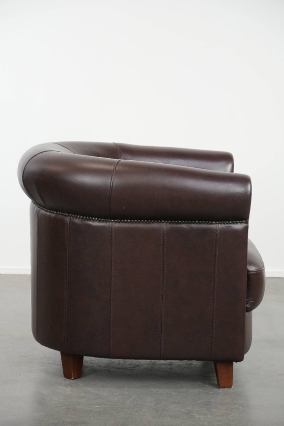 Image 1 of Cowhide club armchair, in very good condition, English style in a brown/dark purple color scheme