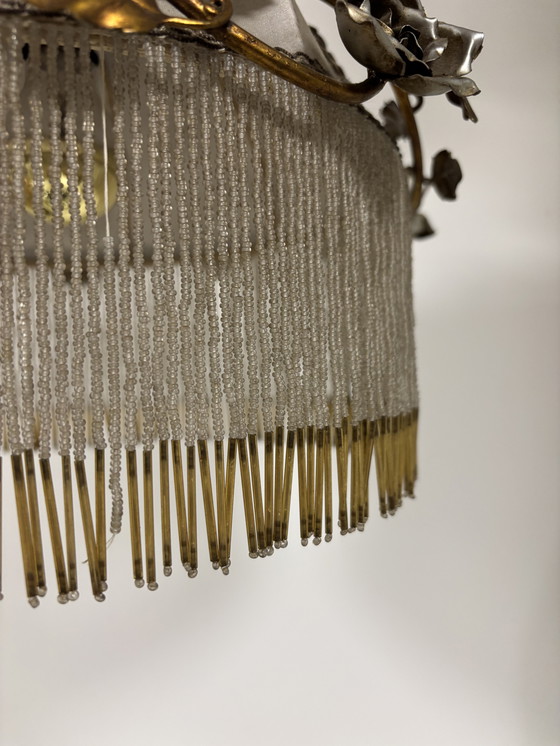 Image 1 of Exclusive chandelier with brass leaves and silver-colored roses