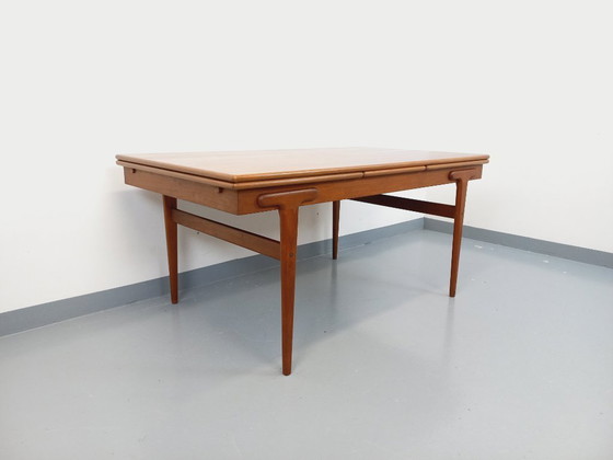 Image 1 of Vintage Scandinavian rectangular dining table by Ejvind A. Johansson from the 50s and 60s in teak with integrated extensions