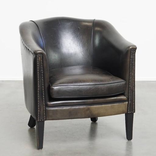  Subtiele zwart/ grijze schapenleren clubfauteuil