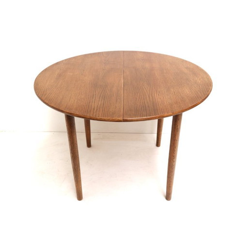 Vintage extendable round dining table from the 1970s