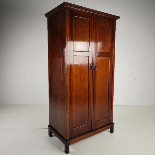 Men's clothing by Maple & Co. from the early 20th century.