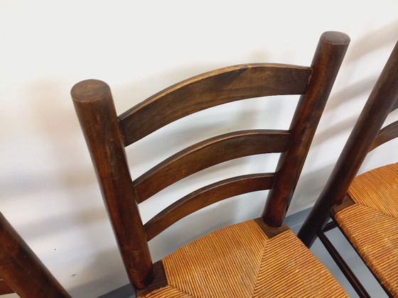 Image 1 of Set van 4 vintage brutalistische stoelen van Georges Robert, gemaakt van hout en stro, uit de jaren 50 en 60.