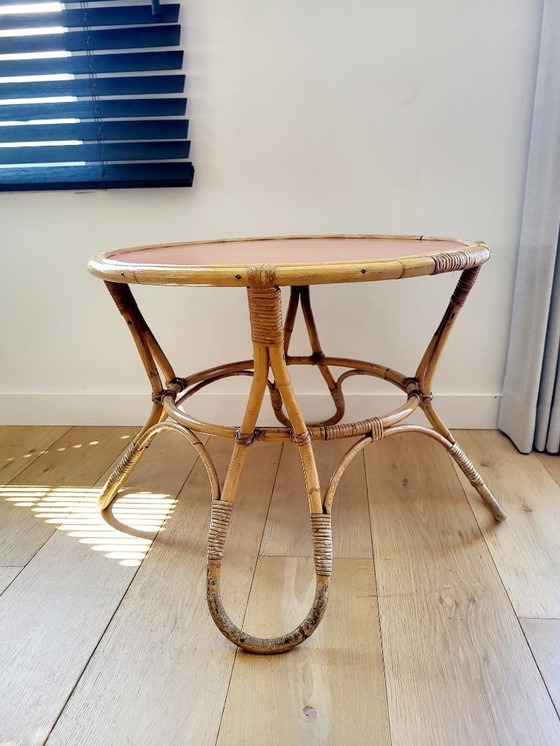 Image 1 of Rattan Couchtisch Modell Diabolo, Design KOK mit orangefarbener Platte