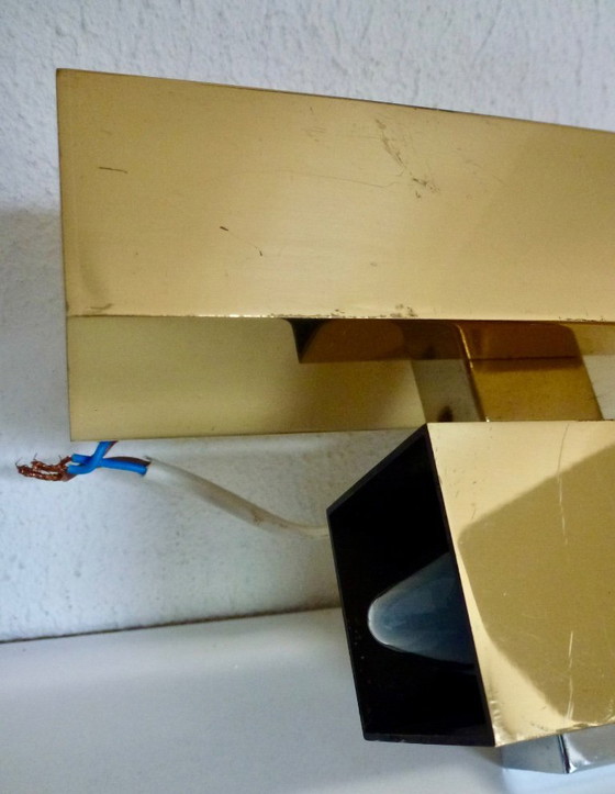 Image 1 of A brass wall lamp, in a minimalist, geometric style, from the middle of the last century.