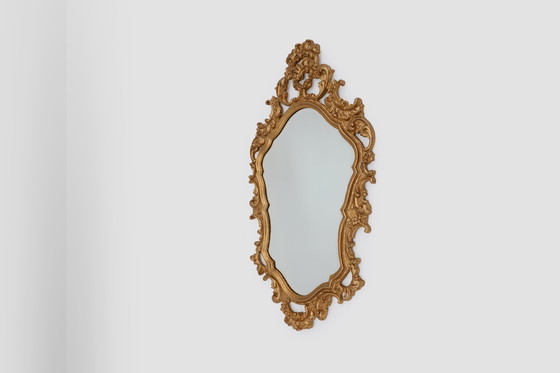 Image 1 of French Rococo or Baroque style facet-cut crest mirror in gilded carved wood