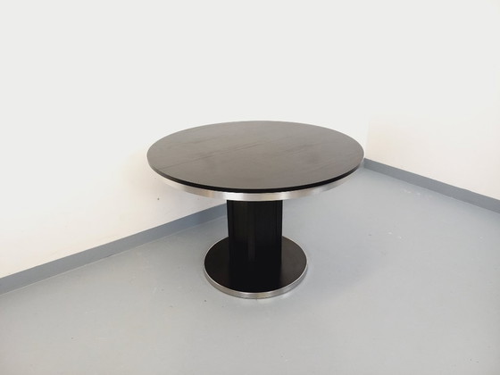 Image 1 of Table ronde de repas vintage en mélaminé esprit bois noir et métal chromé style Space Age / Diner des années 70 avec rallonge in
