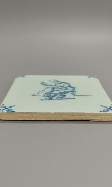 Image 1 of Antique Dutch Delft Tile with Seamstress Motif
