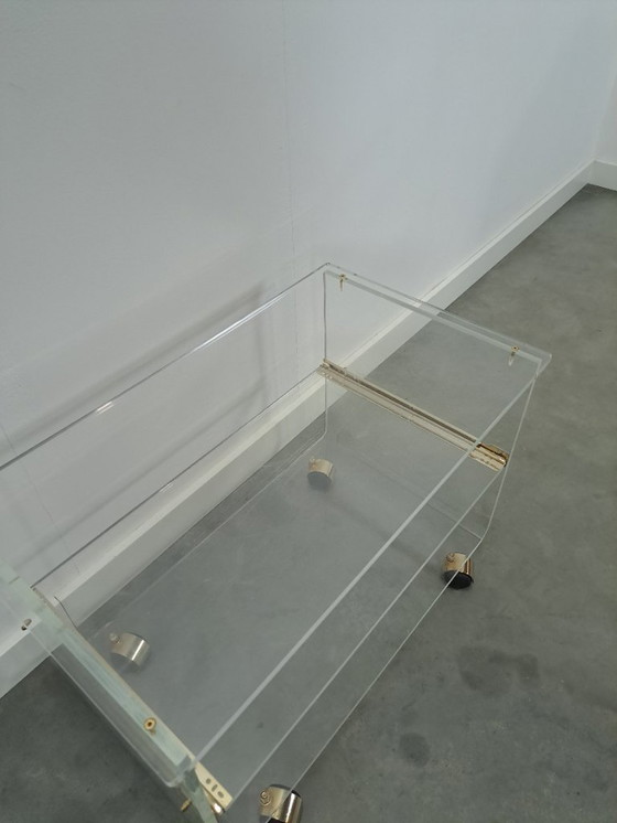 Image 1 of Space age plexiglas trolley met messing