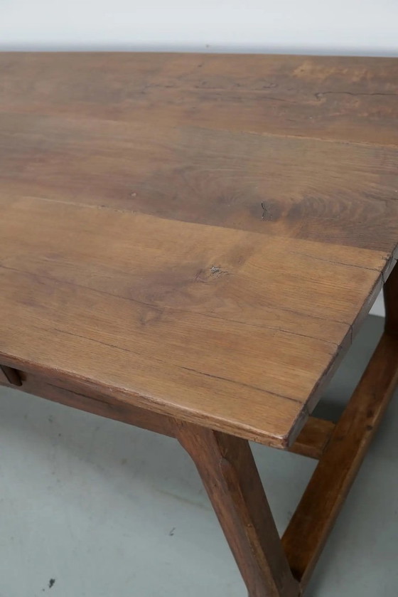 Image 1 of Early 20th-century French rustic country dining table made of oak and elm