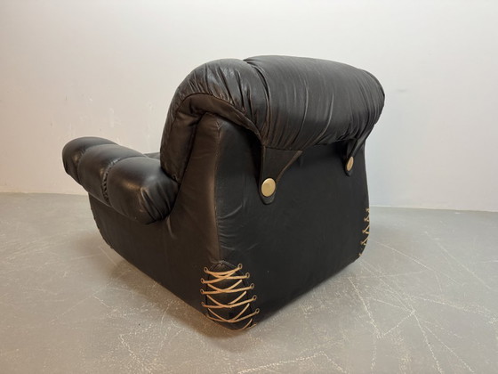 Image 1 of Beautiful Big Black Leather Postmodern Italian Design Space Age Lounge Chair with Brass Buttons and Playful Cord Lacing, 1970s.