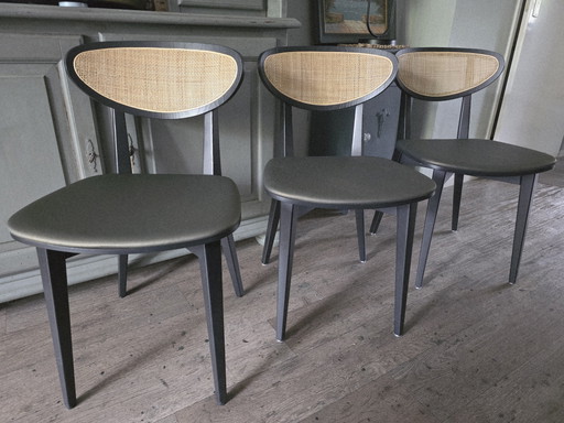 3 chairs with green seats and webbing in the back
