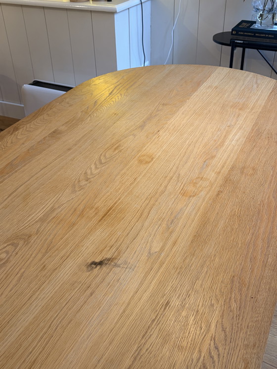 Image 1 of Menu Snaregade Oval Table Oak with black metal base