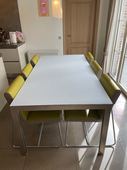 Leolux eettafel glas + 6 stoelen limoengroen leolux