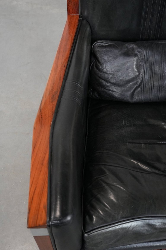 Image 1 of Black cowhide and wooden Art Deco design armchair by Schuitema from the Decoforma series with decorative cushion
