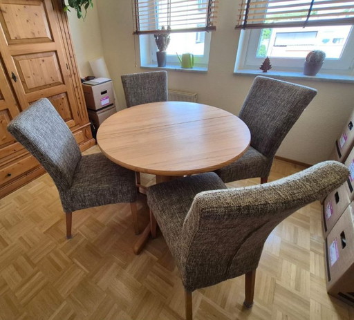 Mesa de comedor de madera maciza redonda y plegable.