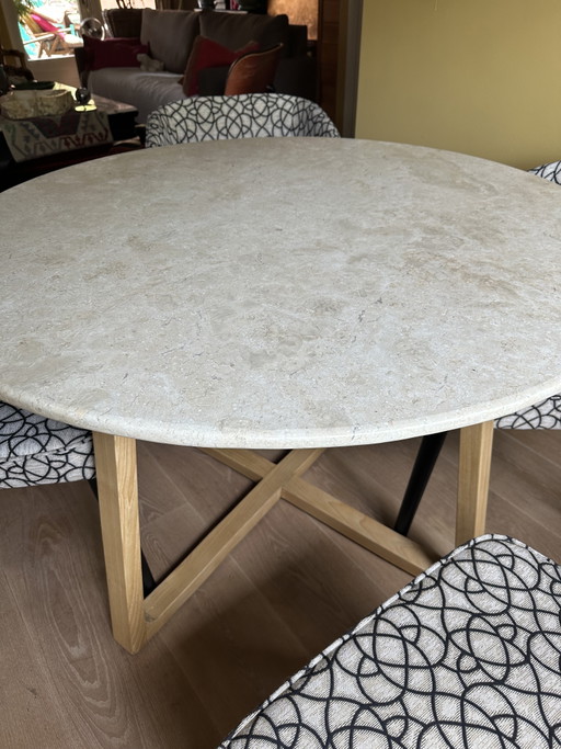 Round travertine dining table