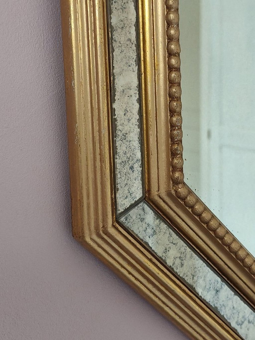 Antique mirror with gilded wood and parcloses