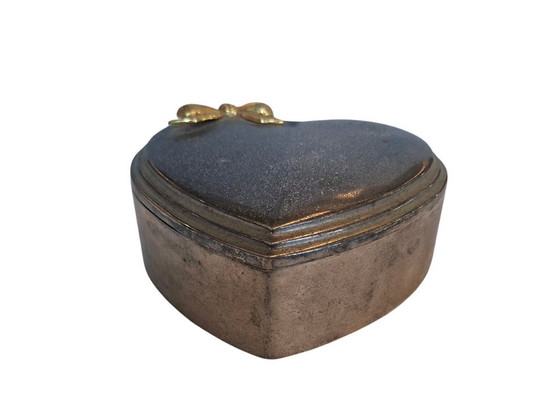 Image 1 of Heart-Shaped Metal Jewelry Box with Gold Bow and Red Velvet Interior
