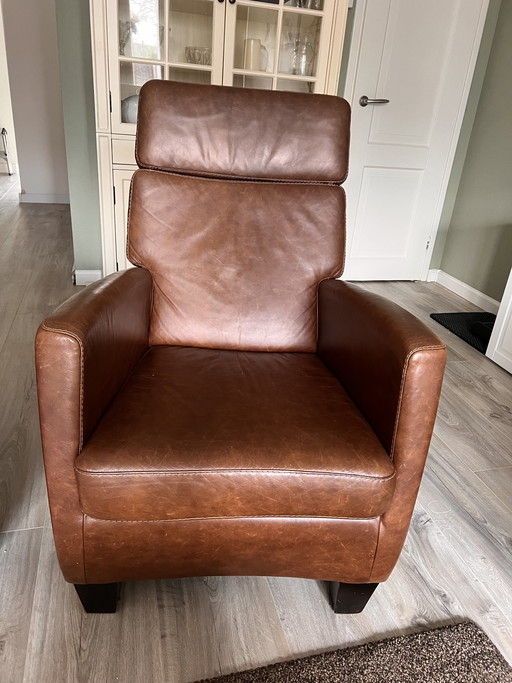 Two brown leather armchairs for sale