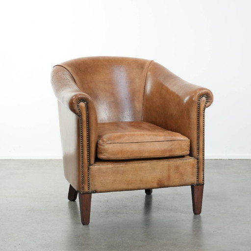 Fauteuil club en peau de mouton aux magnifiques teintes cognac clair