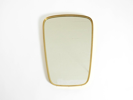 Image 1 of A pair of rare original Mid Century Modern "Münchener Zierspiegel" wall mirrors with heavy brass frames