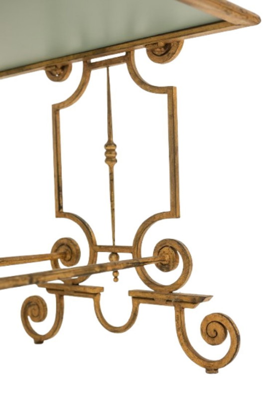 Image 1 of Table basse en fer forgé doré et plateau de verre églomisé. Années 1970