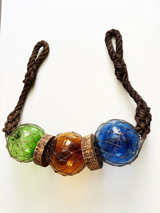 Image 1 of Fishing float made of blown glass, cork, and rope. France, 1960s