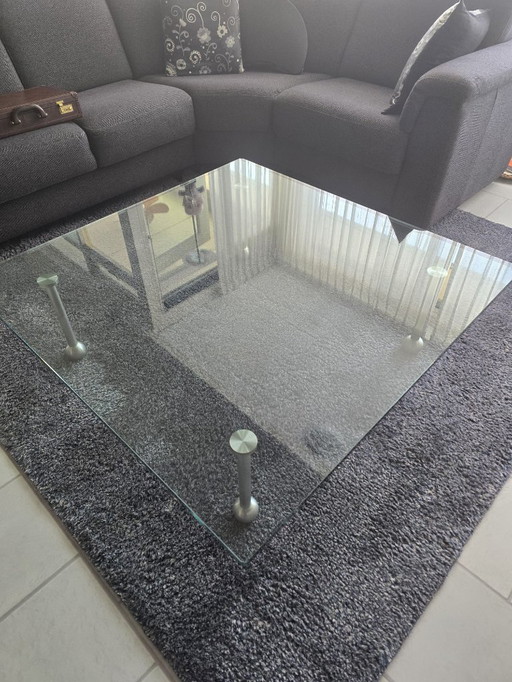 Design glass table with stainless steel legs; square model