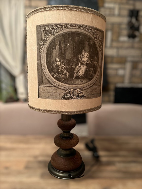 Image 1 of Beautiful vintage table lamp with a motif. Made of wood and metal. Height: 59 cm. Lampshade diameter: 30 cm.