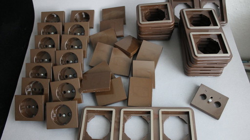 Large collection of vintage brown light and socket switches from the 1970s, brand BLASS.