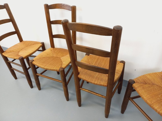 Image 1 of Set van 4 vintage brutalistische stoelen van hout en stro uit de jaren 60.