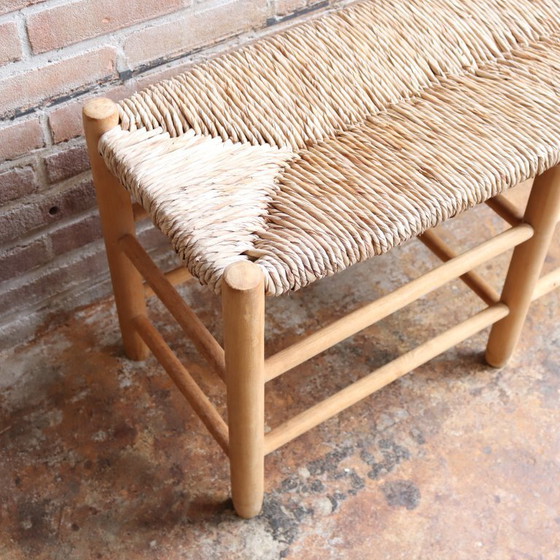 Image 1 of https://www.meutt.nl/a-109283495/fauteuils-stoelen/vintage-oud-bankje-rieten-zitting-hal/