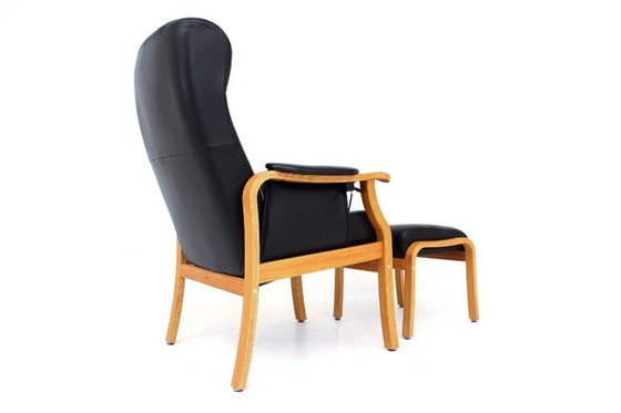 Image 1 of as new, Danish Nordic Easy Lounge Chair / Relax Armchair with stool in oak and leather.