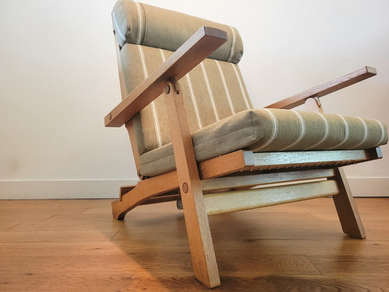 Image 1 of Fauteuil en Voetenbank van Hans J. Wegner voor AP Stolen