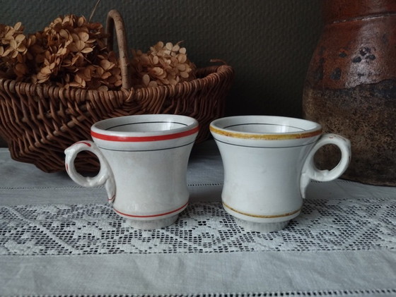 Image 1 of Een paar Sarreguemines ondoorzichtige porseleinen vuurkorfjes (1857-1900)