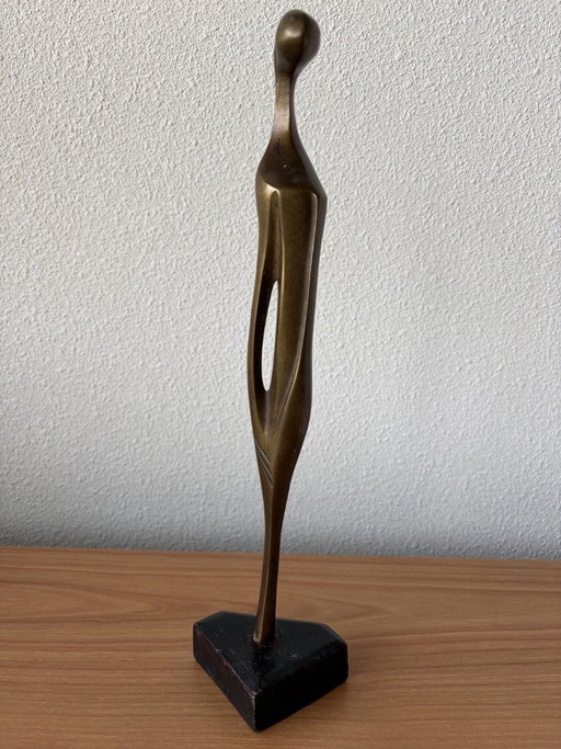 Modern slender bronze sculpture on wooden base - 33 cm