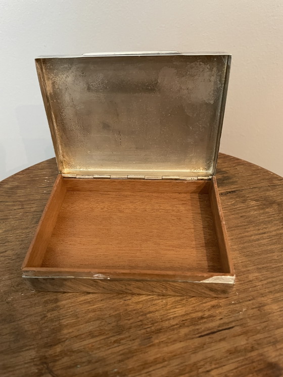 Image 1 of Estuches para cigarrillos y apagavelas, chapados en plata.