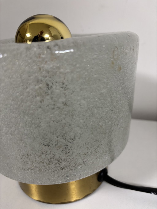 vintage table lamp by Peill & Putzler is made of thick ice glass with brass details