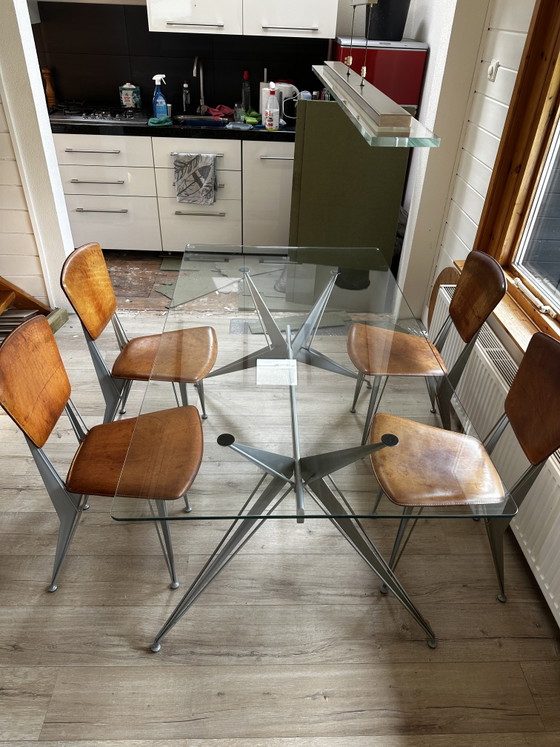 Image 1 of Table de salle à manger design avec 4 chaises en cuir assorties