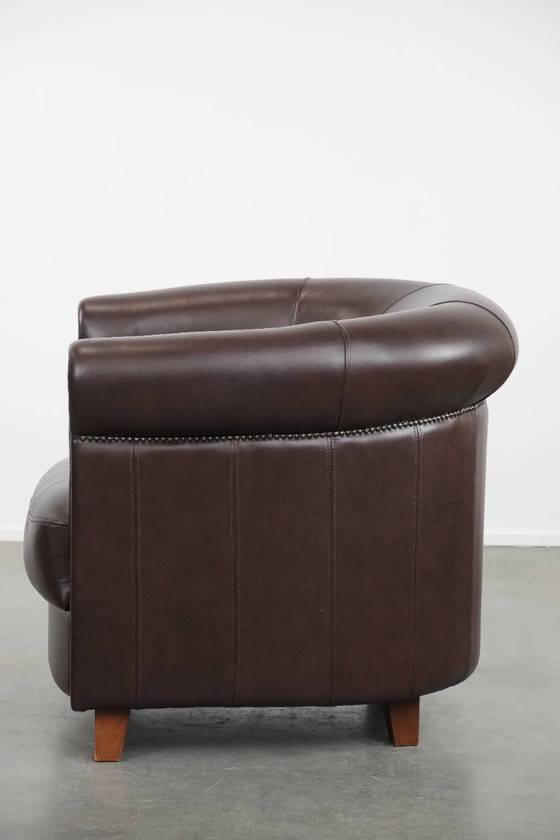 Image 1 of Cowhide club armchair, in very good condition, English style in a brown/dark purple color scheme