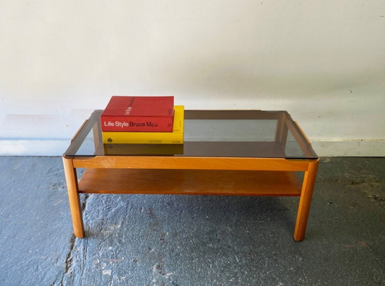 Image 1 of Table basse en teck style années 50 avec plateau en verre fumé, par Myer