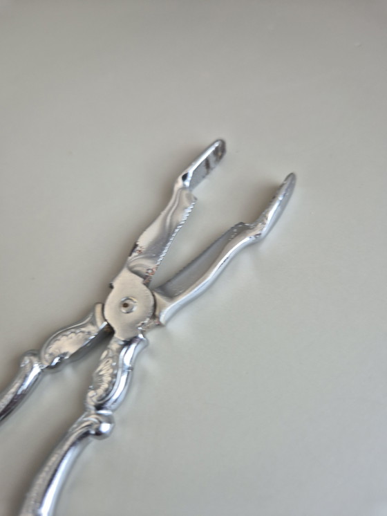 Image 1 of Pinze da portata vintage in metallo cromato - stile barocco decorativo