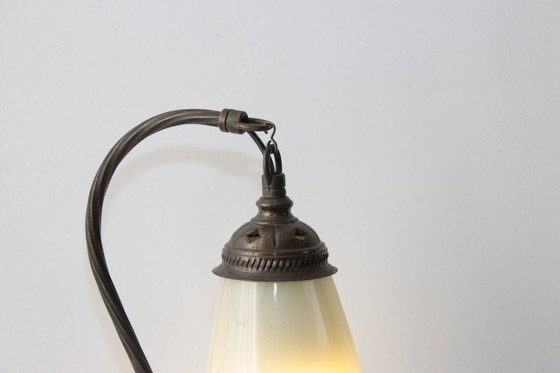 Image 1 of Vintage brass table lamp with curved arm and glass shade