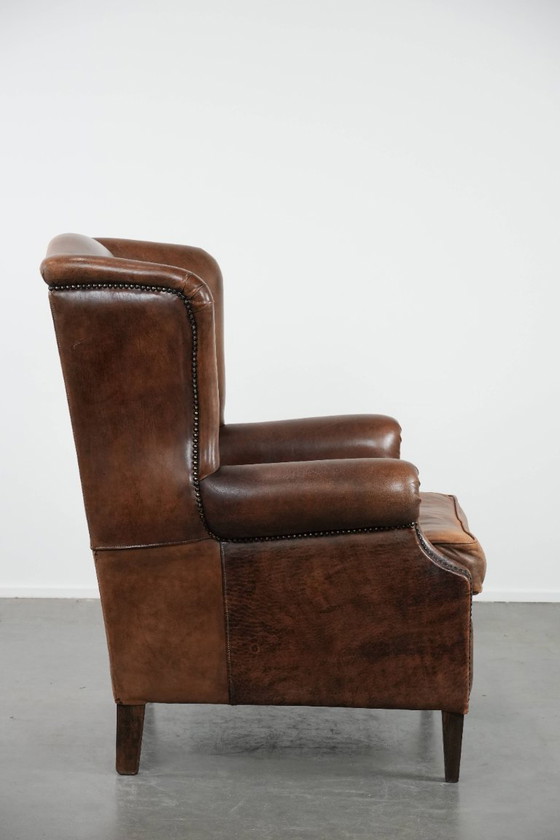 Image 1 of Comfortable vintage sheepskin wing chair with character