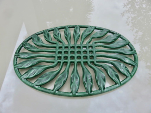 Large oval green enameled cast iron trivet, France, 1960s