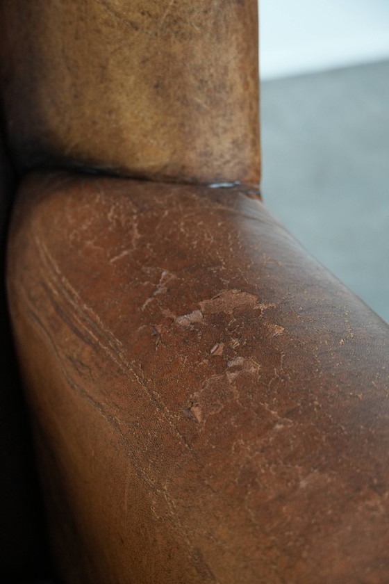 Image 1 of Sheepskin wing chair with a characterful appearance
