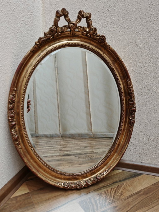 Oval mirror with wooden frame, gold from an estate